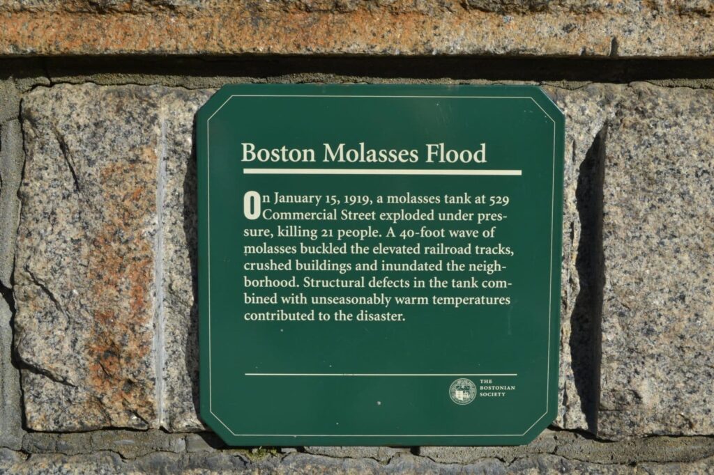 A commemorative green plaque to the Boston Molasses Flood